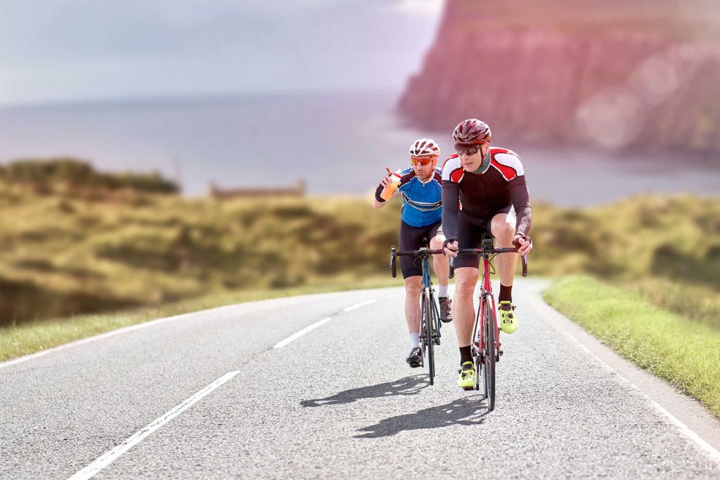 Pedal Britain group of cyclists at land's end.